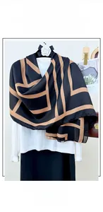 Detail of printed cotton linen scarf with black base and brown geometric line patterns