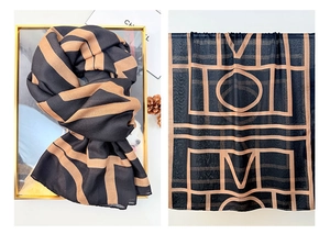 Detail of classic retro cotton linen scarf with geometric line prints and letter patterns