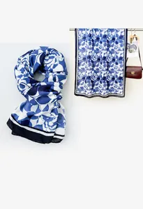 Detail of navy and white floral linen shawl with abstract geometric patterns
