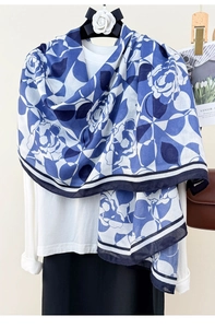 Close-up of blue and white rose floral print scarf with elegant striped border