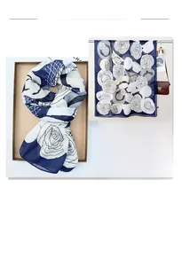 Detail showing the floral pattern and soft texture of a navy cotton linen scarf shawl