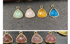 Close-up of pear-shaped faceted gemstone pendants with gold bezel for DIY jewelry