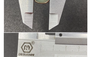 Macro shot showing exact measurement of light green teardrop gemstone with gold border