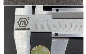 Detailed measurement of 12mm round green jade pendant with gold bezel setting