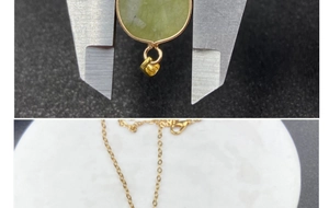 Close-up of green jade pendant size measurement with gold chain and lobster clasp