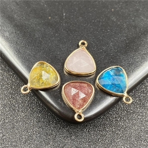Set of four multi-colored faceted teardrop pendants with gold metal edging for DIY jewelry