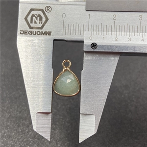 Pale green faceted water drop gemstone pendant with gold metal border and 10mm width measurement