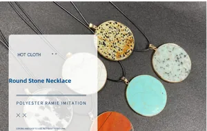 Detail of round gemstone pendants with natural textures and gold-plated frames on black cord