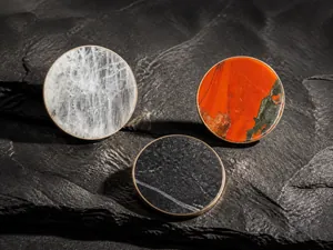 Macro shot of natural crystal pendants with intricate textures and metallic edges