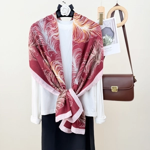 Elegant wine red cotton linen scarf with vintage feather prints on a decorative hanger
