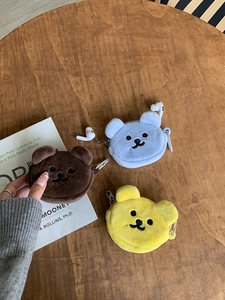 Three cartoon bear plush coin purses in brown blue and yellow with metal carabiner clips
