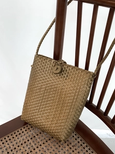 Minimalist dark brown woven shoulder bag for summer beach holidays and daily commute