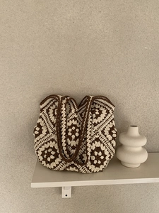 Detailed close-up of handmade crochet tote bag with vintage geometric floral pattern