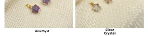 Detail of star-shaped amethyst and white crystal pendants with gold plated edges