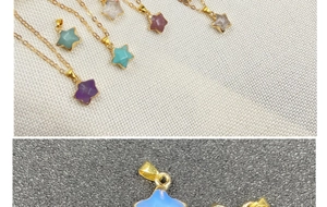 Detail of star-shaped gemstone pendants with gold plated chains in various colors
