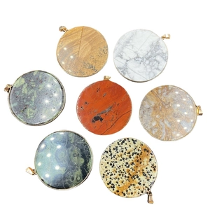 Set of seven round natural stone pendants with elegant gold metal edges and hanging loops