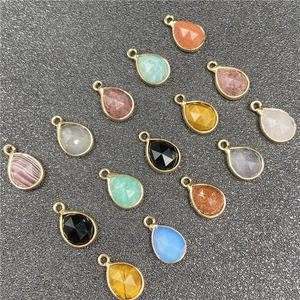Faceted teardrop stone pendants with gold metal edging in various assorted colors