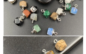 Detailed close-up of multifaceted natural stone pendants with silver metal clasps for DIY