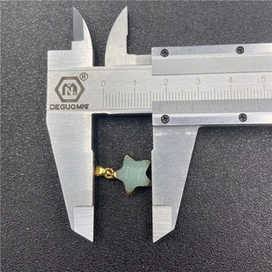 Star-shaped green jade pendant necklace measured with caliper showing 1.5cm width