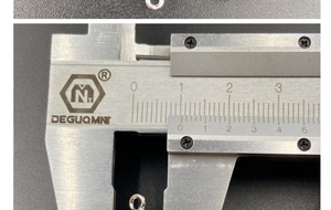 Detail view of caliper measuring the 10mm diameter of silver octagonal crystal pendant