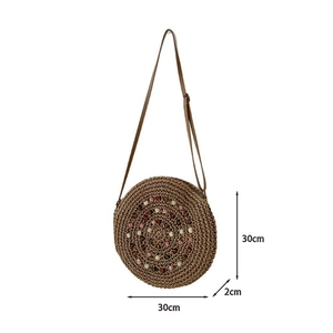Detail view of round woven straw bag with beads showing 30cm diameter and 2cm thickness