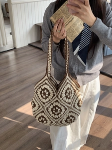 Handmade crochet tote bag with brown and beige floral patterns for casual travel