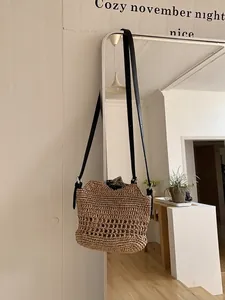 Handwoven large capacity straw beach bag with black leather strap in khaki knit