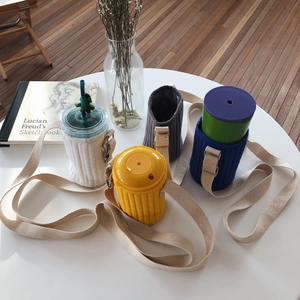 Quilted fabric water bottle carrier with adjustable strap in four neutral colors