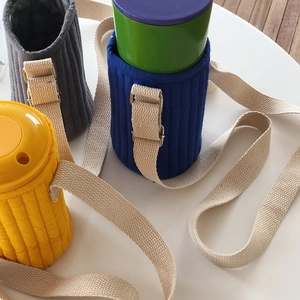 Quilted water bottle sleeves in blue, yellow and gray with adjustable shoulder straps