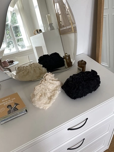 Lace flower clutch bags in beige and black featuring elegant pearl clasps and floral texture