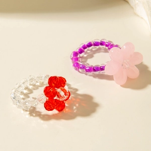 Colorful handmade floral beaded rings with acrylic crystal beads in pink and purple