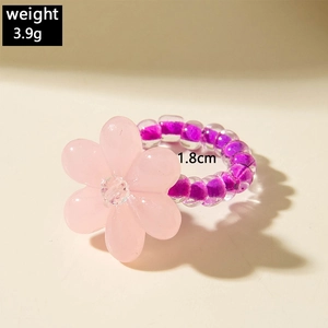 Detail shot showing 1.8cm diameter and 3.9g weight of a pink floral beaded ring