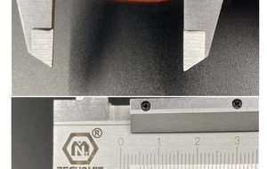 Close-up measurement of a pink agate stone pendant using silver vernier calipers