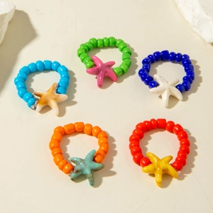 Detailed set of 5 colorful beaded rings featuring marble-textured starfish charms