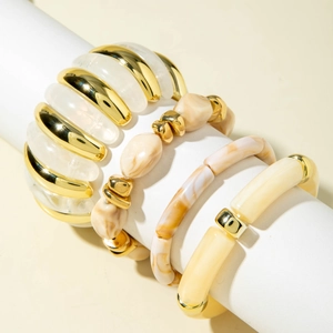 Detailed close-up of a 4-piece bracelet set with marble resin beads and metallic accents