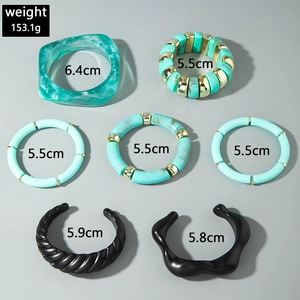 Detail view of 7-piece acrylic resin bracelet set with beads and curved tube charms