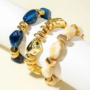 Three-piece set of irregular acrylic beaded bracelets with blue and gold metal accents