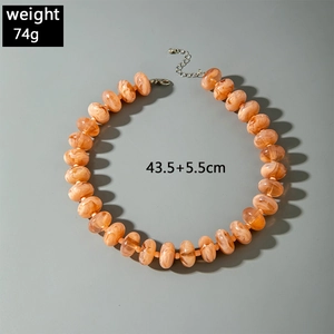 Detail of colorful acrylic beaded necklace with marble texture and size measurements
