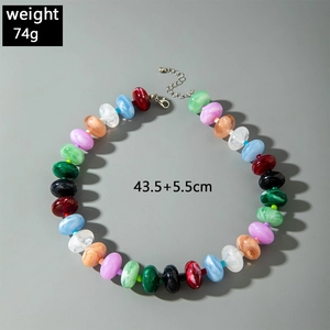 Detail of colorful acrylic beaded necklace showing marble textures and lobster clasp closure