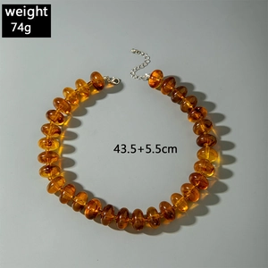 Detail view of colorful acrylic beaded necklace with 74g weight and lobster clasp