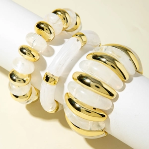 Detailed close-up of three-piece irregular acrylic beaded bracelets with gold plated accents