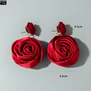 Detailed view of red satin rose earrings with velvet buds and product dimensions