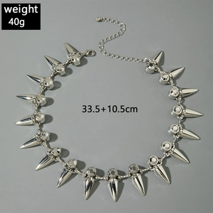 Detail of silver punk spike necklace featuring rhinestones and lobster clasp closure