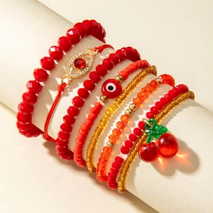 Red cherry and evil eye beaded bracelet set of seven with faceted glass and resin charms
