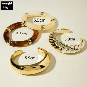 Four-piece gold spiral geometric cuff and resin bead bracelet set for fashion jewelry