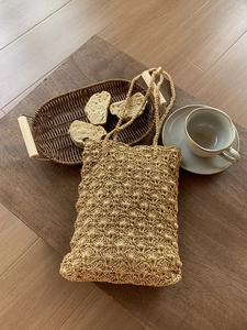 Exquisite golden hand-woven crochet tote bag with metallic yarn and scallop shell patterns