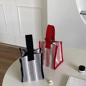 Detail showing two striped canvas lunch bags with thermal aluminum foil insulation