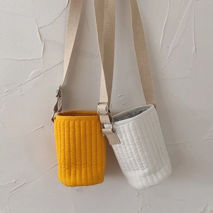 Quilted insulated water bottle sleeve with adjustable strap in yellow and cream