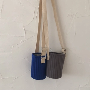 Quilted cartoon water bottle sleeve with adjustable shoulder strap in navy and grey