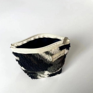 Plush camouflage storage bag with metal zipper and nice to meet you textile label